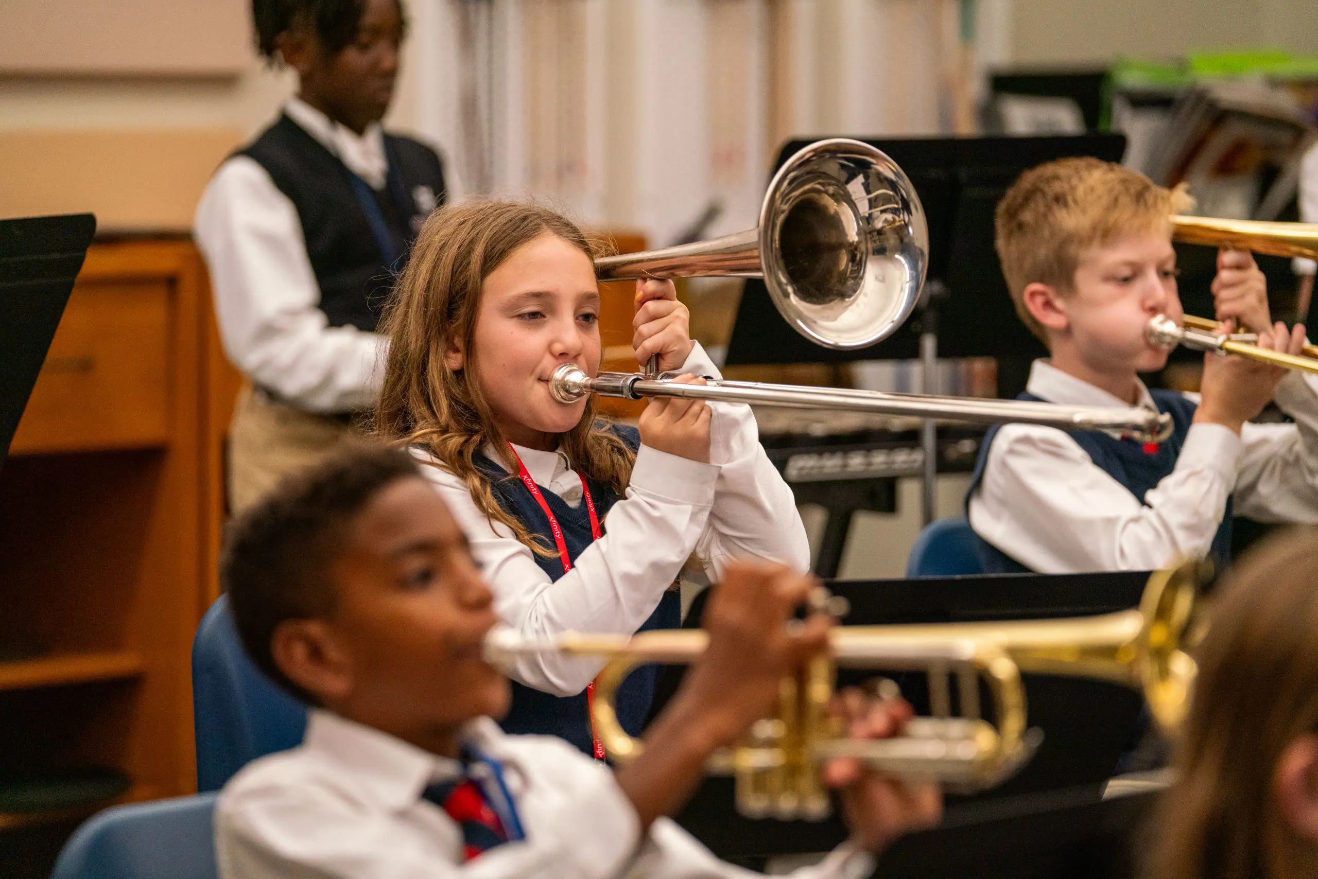 Students playing brass instruments