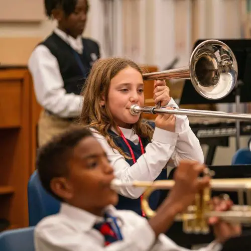 Student playing a brass instrument