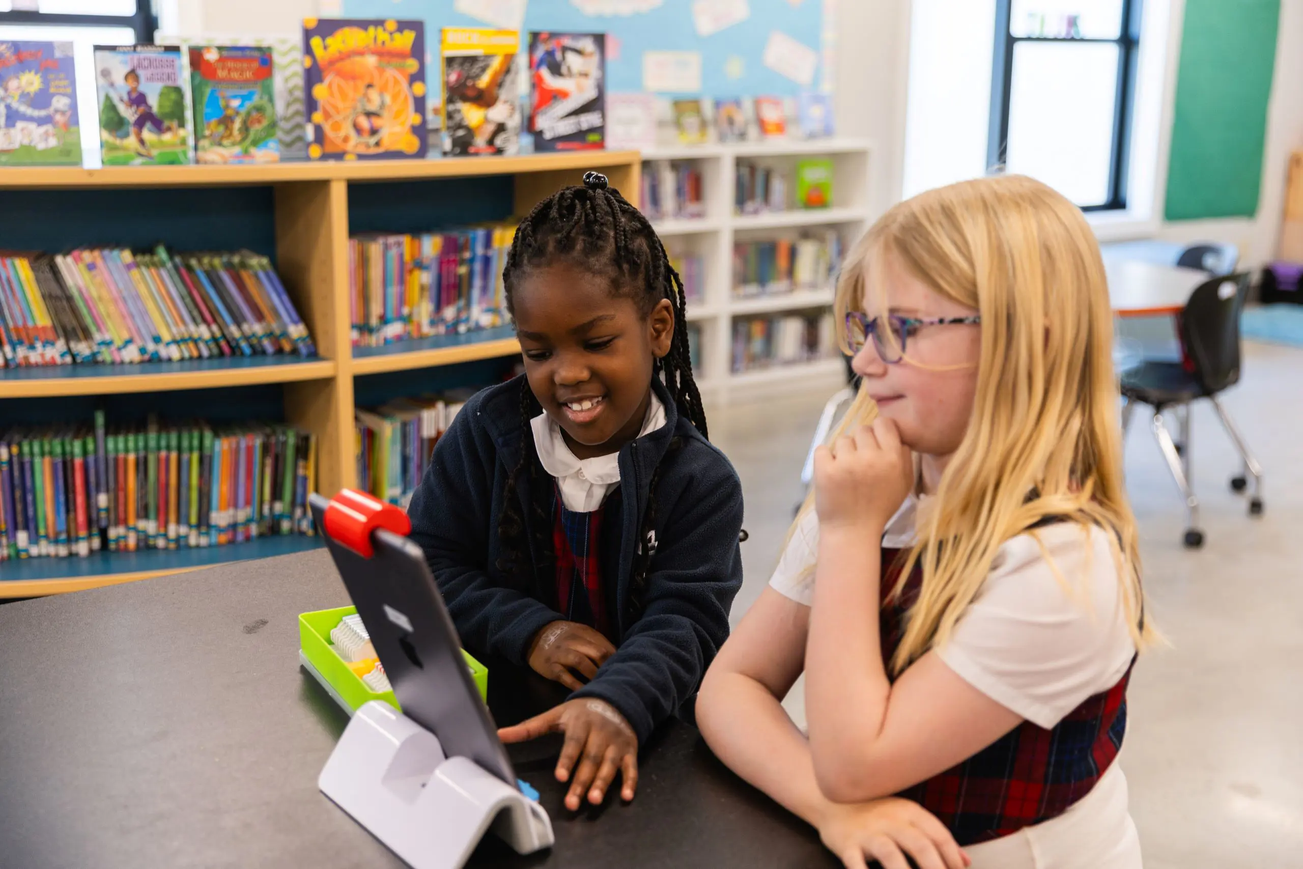 Two schoolchildren at a table