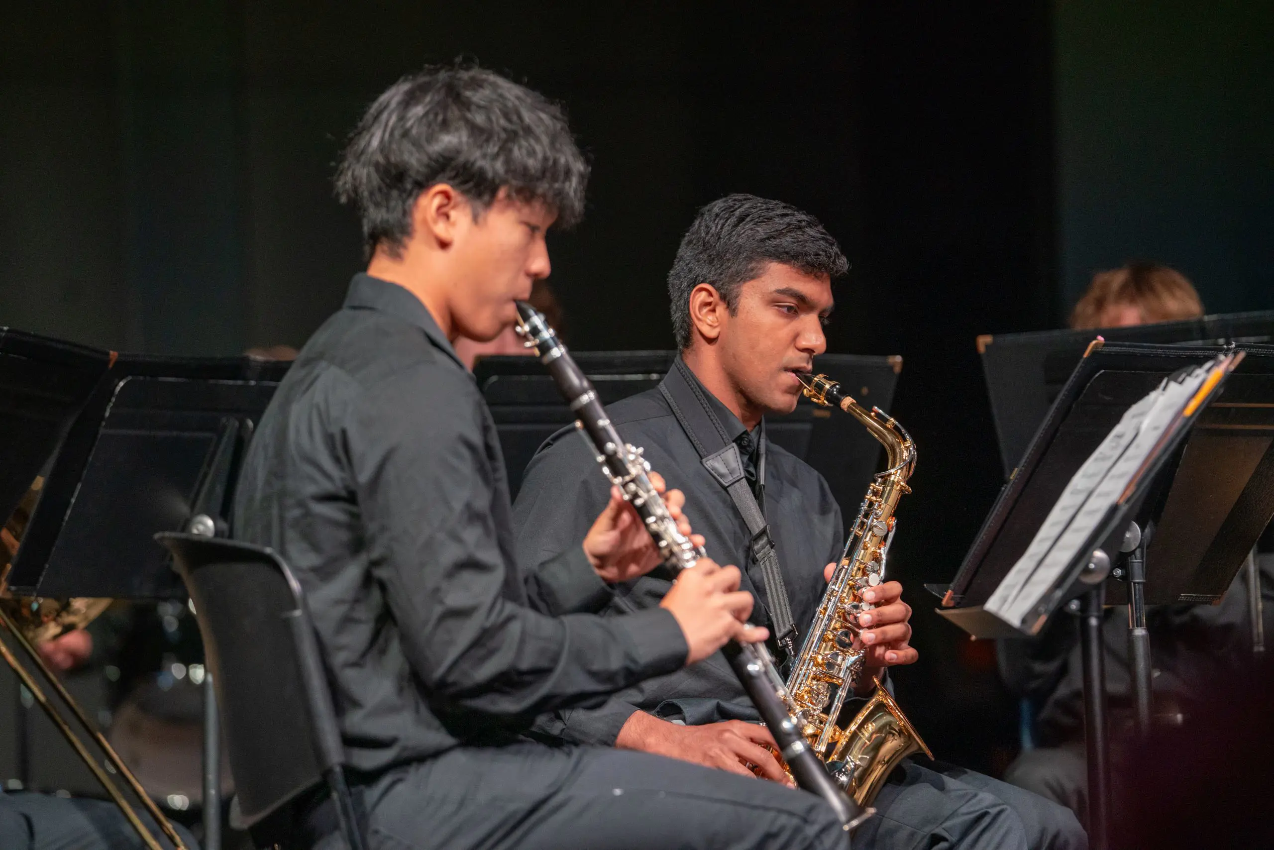 Students playing instruments onstage