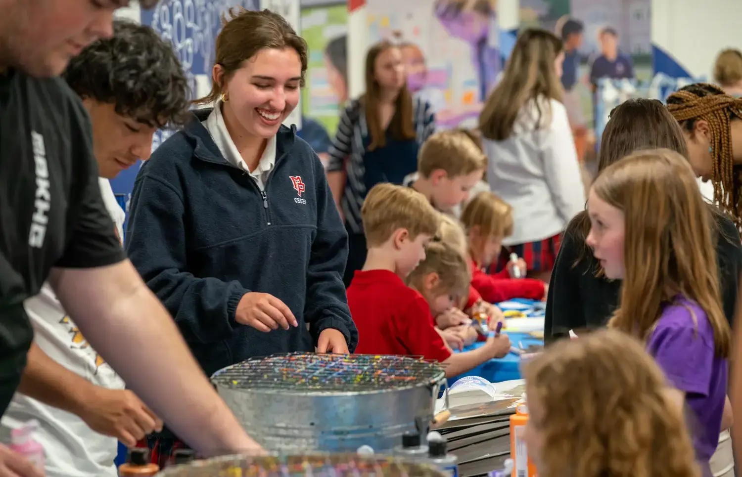 Students smiling at an art workshop