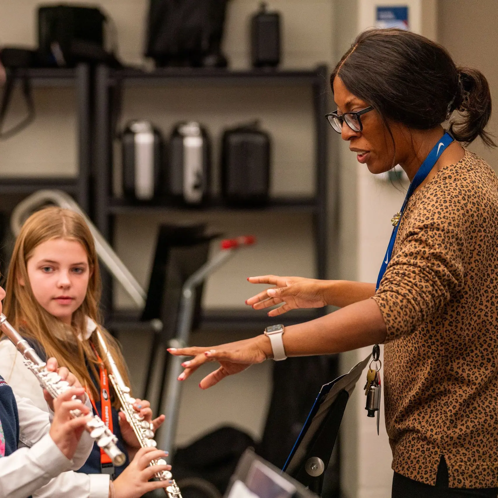 Music teacher instructing students