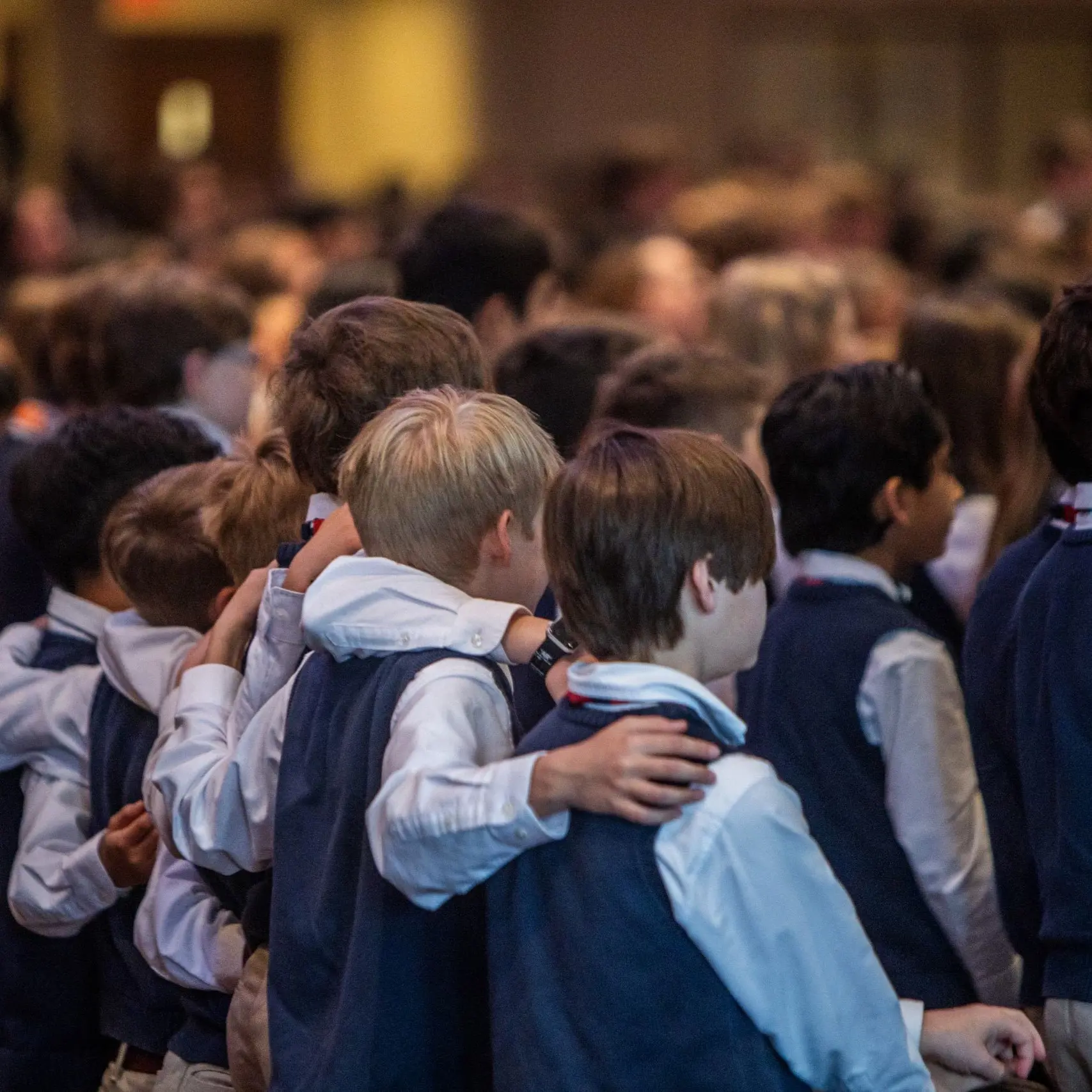 Group of boys with arms around each other