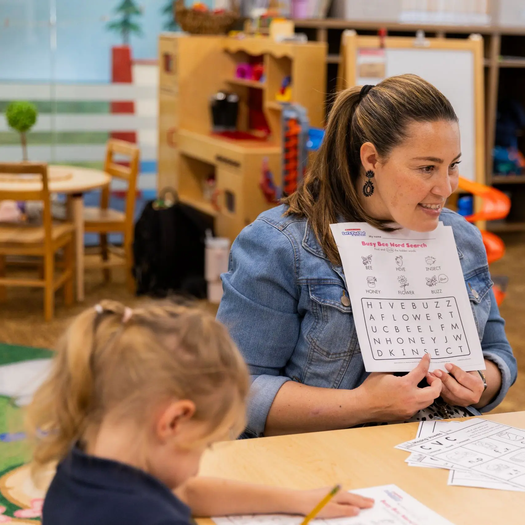 Teacher showing a demonstration to children